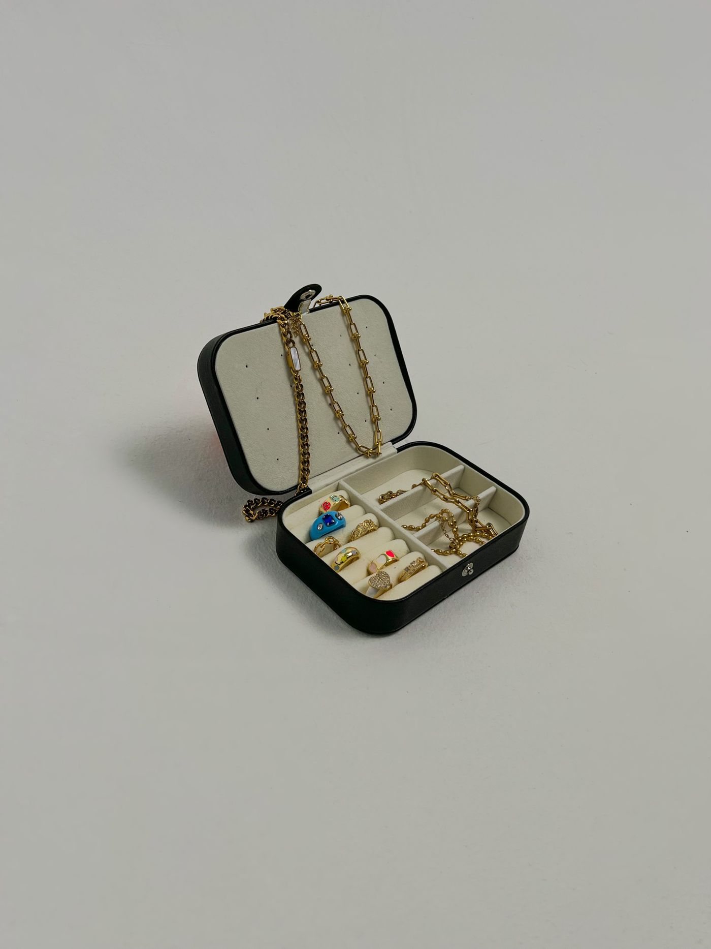 Open jewellery box containing necklaces and rings